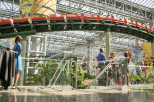 Meeting attendees in front of a roller coaster in Nickelodeon Universe.