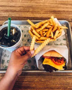 A pop, fries, and burger from Shake Shack