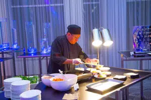 A banquet chef plating dishes