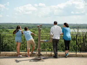 Family of 4 looks over Minnesota Valley National Wildlife Refuge