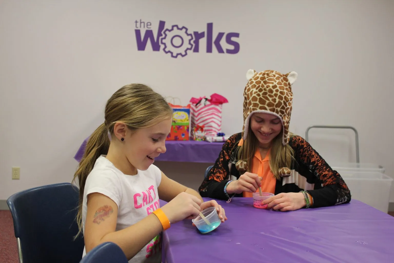 Two girls working on a hands-on engineering project