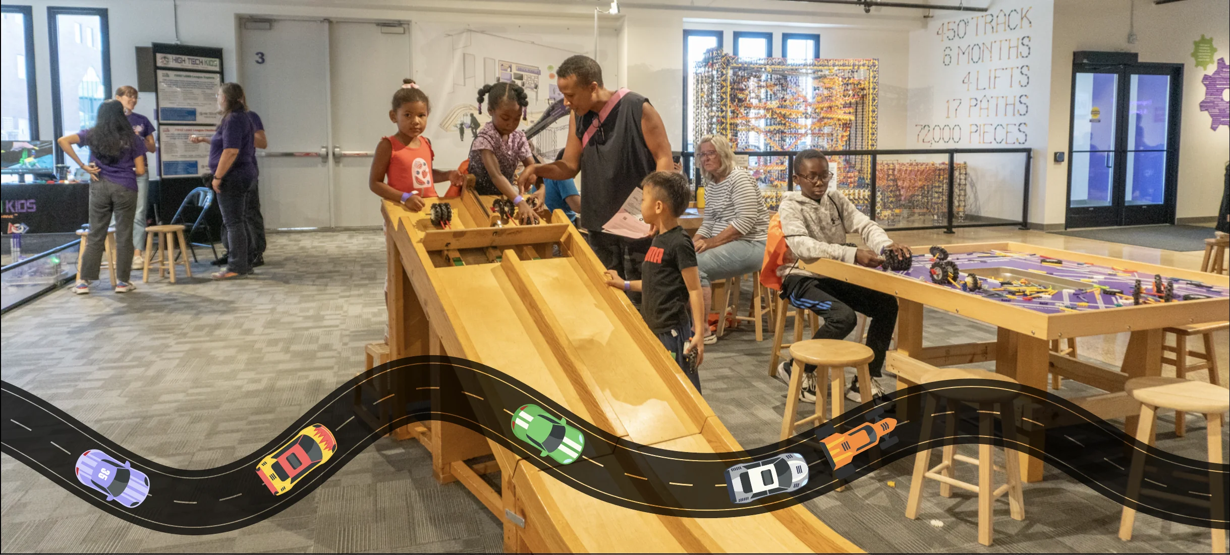 Kids prepare to race K'NEX cars down a ramp